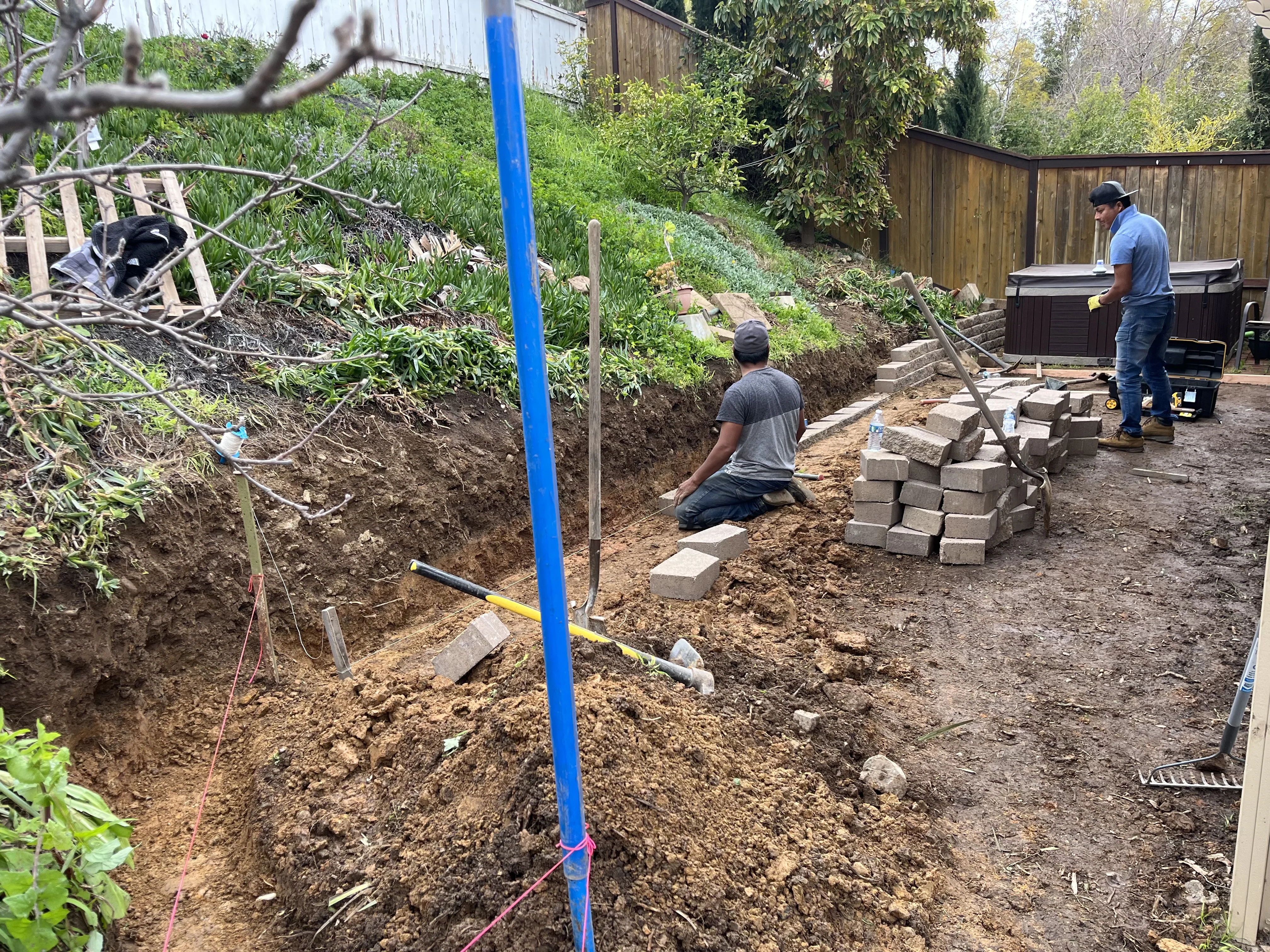 Before photo of damaged brick wall project in Aliso Viejo, CA by Lobato Landscaping