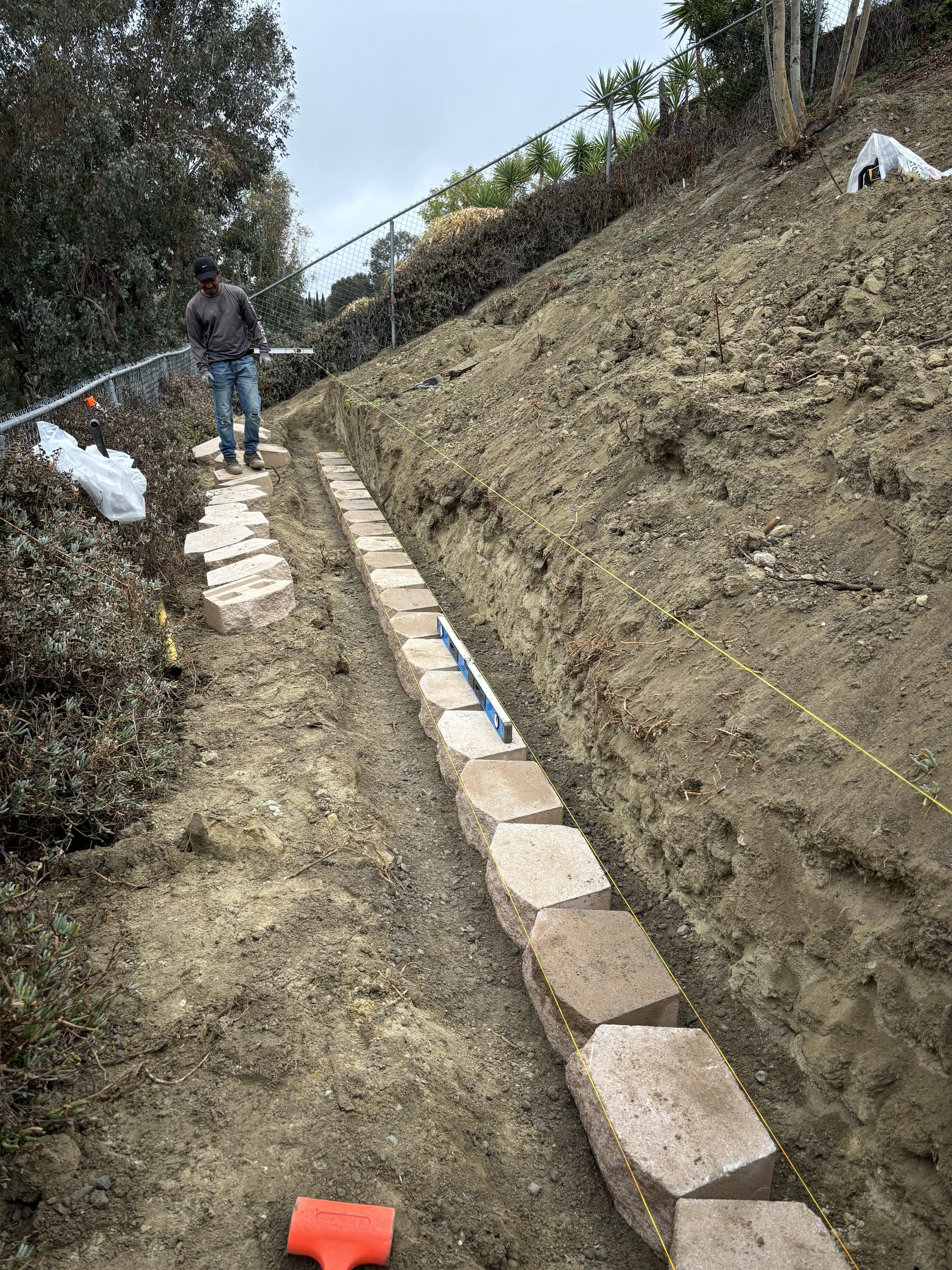 Before photo of failing slope and brick wall project in Rancho Mission Viejo, CA by Lobato Landscaping