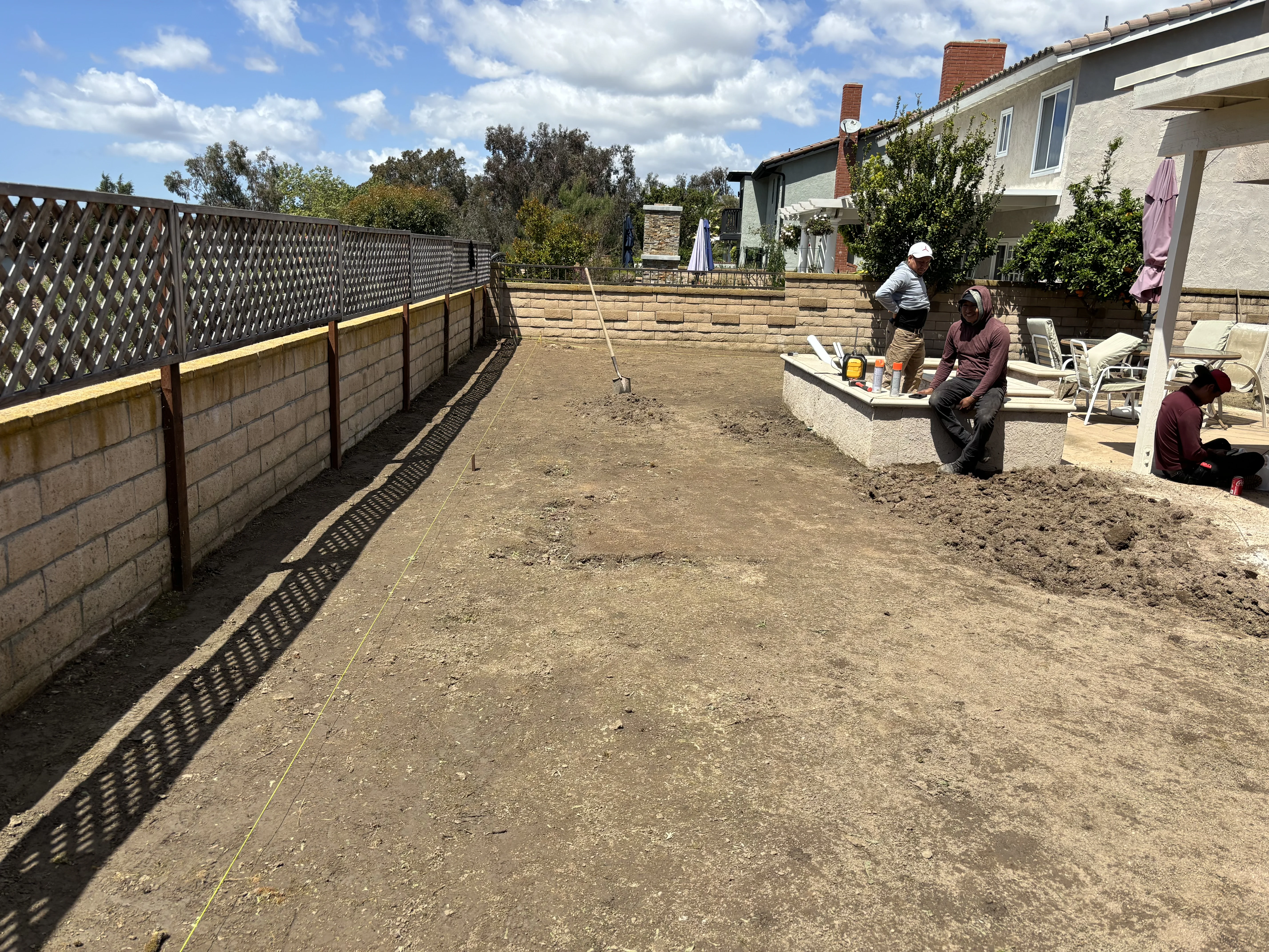Before photo of patchy lawn before premium artificial turf installation in Mission Viejo, CA by Lobato Landscaping