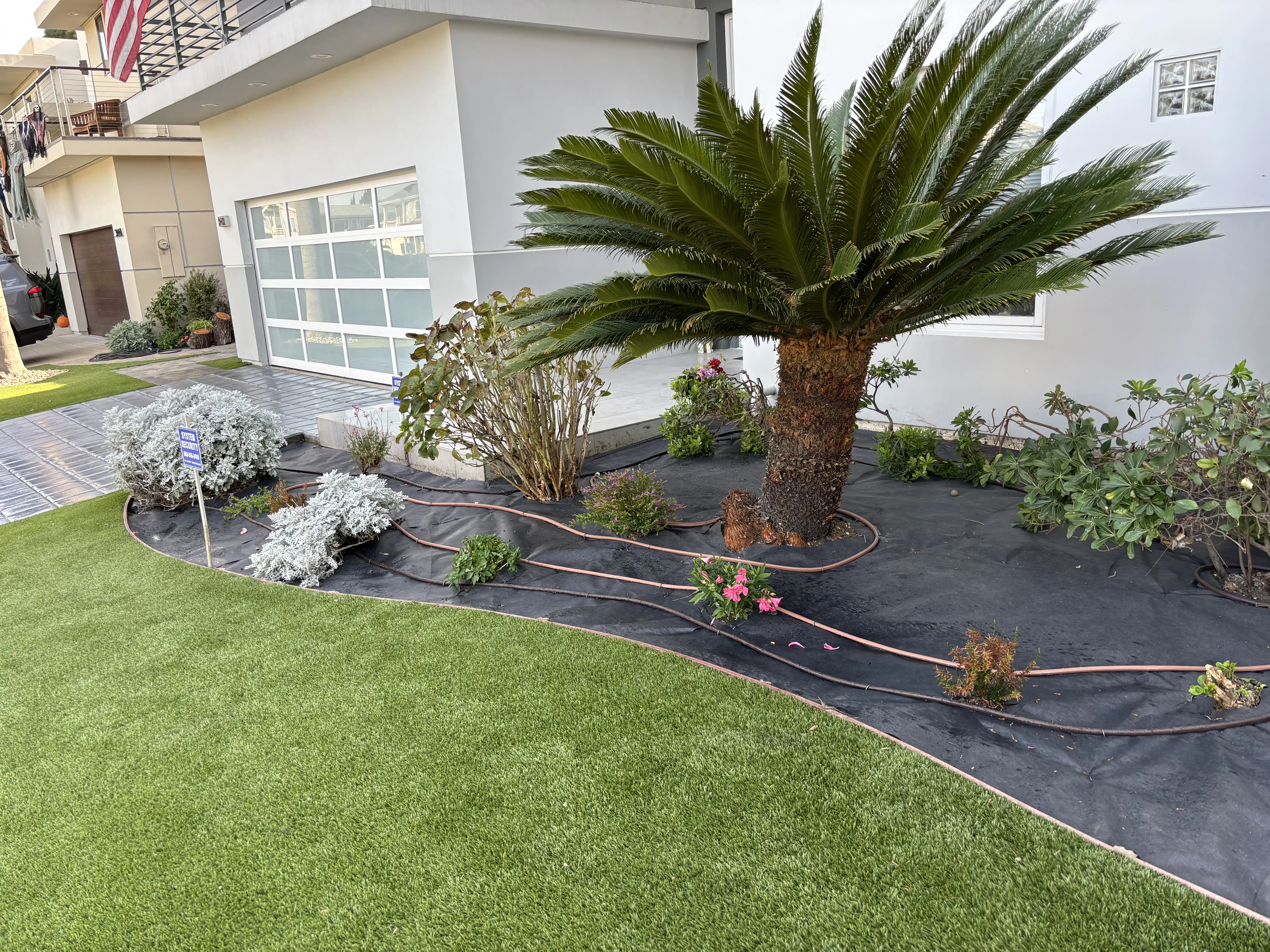 Before photo of neglected rock and lawn area in Dana Point, CA by Lobato Landscaping